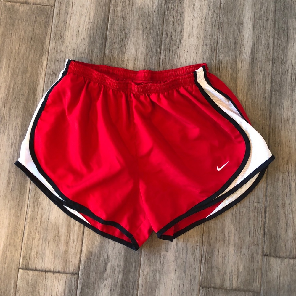 Red Nike running shorts.